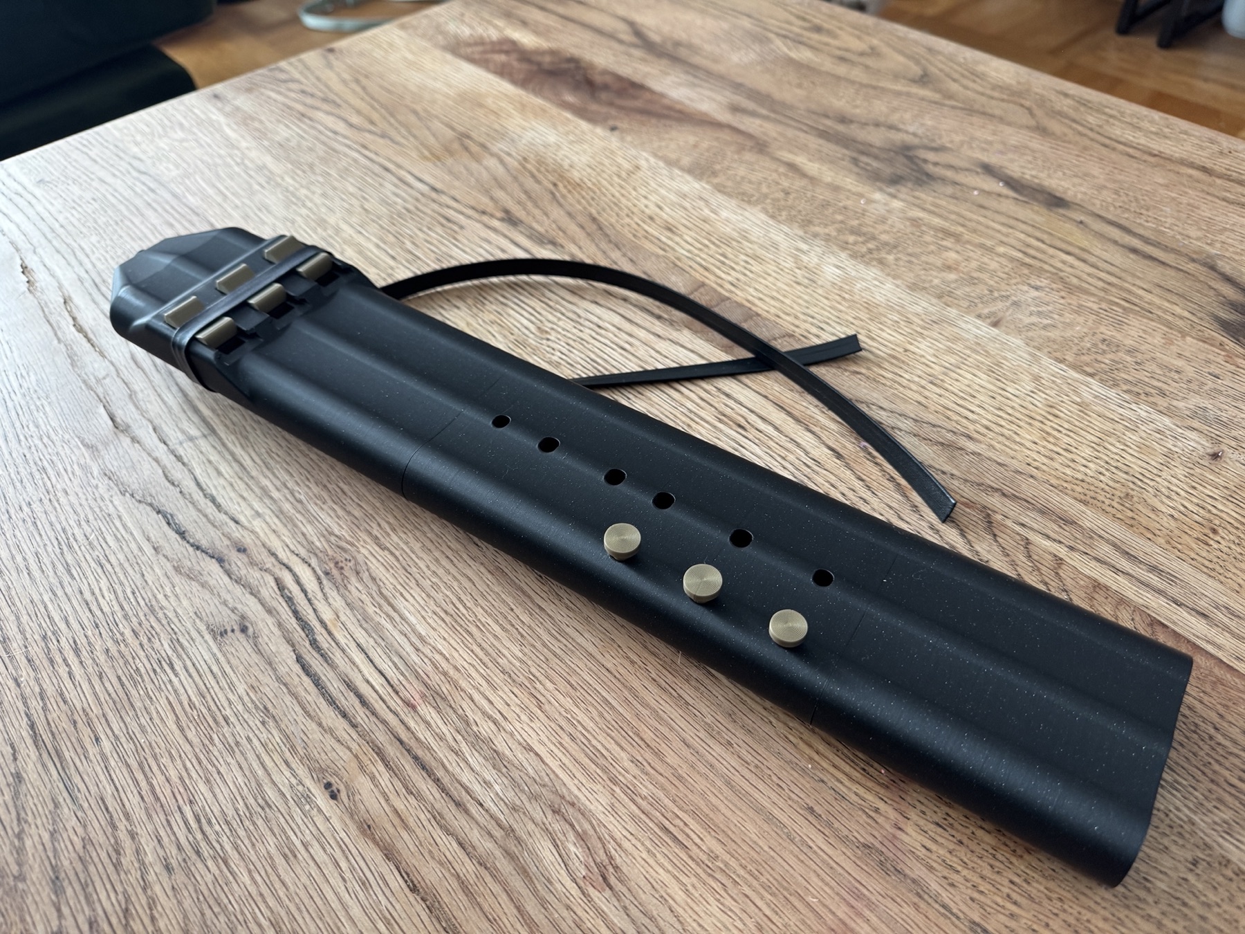Black A 432 Hz triple drone flute on wood table