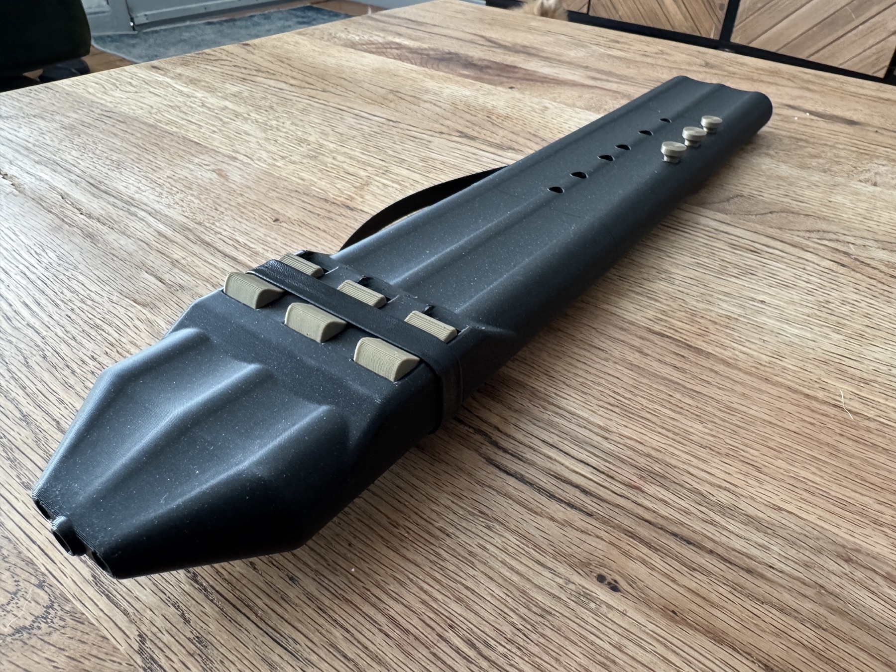 Triple drone blocks and finger holes on black flute